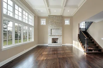 Hand-finished hardwood flooring in a formal Inland Empire living room installed by Monteros